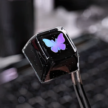 Keycap with a butterfly  icon on a blurred background